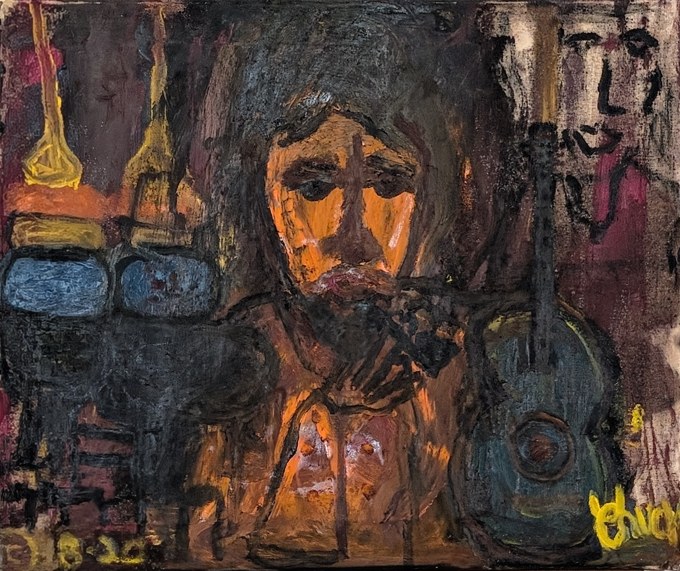 Orange-toned face in a dark room with a blue-green guitar at the right.