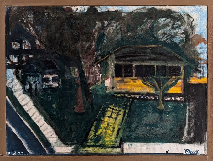 Dark house and large tree beside a yellow-lit porch and diagonal path.